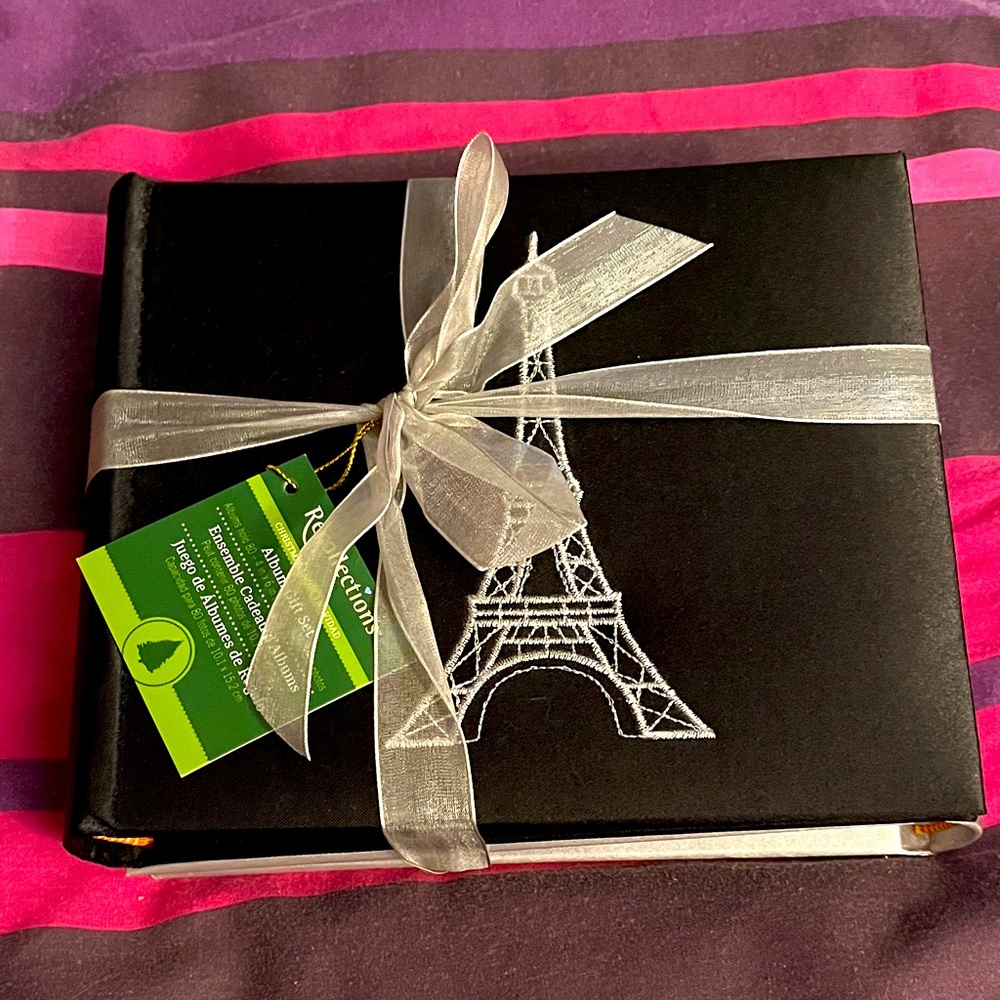 Set of 2 photo albums. One Black with Eiffel Tower Embroidery, one plain silver